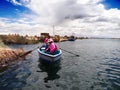 Two women navigating Lake Titicaca